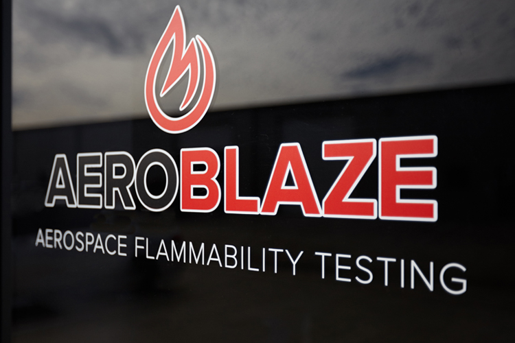 Aerospace flammability testing logo on front door
